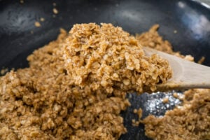 Flapjack mixture on a wooden spoon